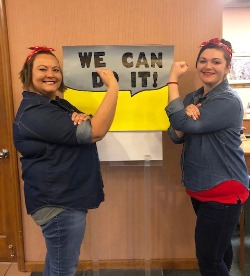 Bank employees dressed up as Rosie the Riveter